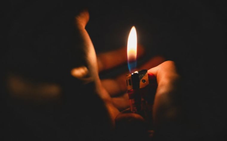 antique lighters for sale with a lit flame